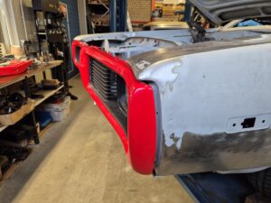 Front bumper tucked in